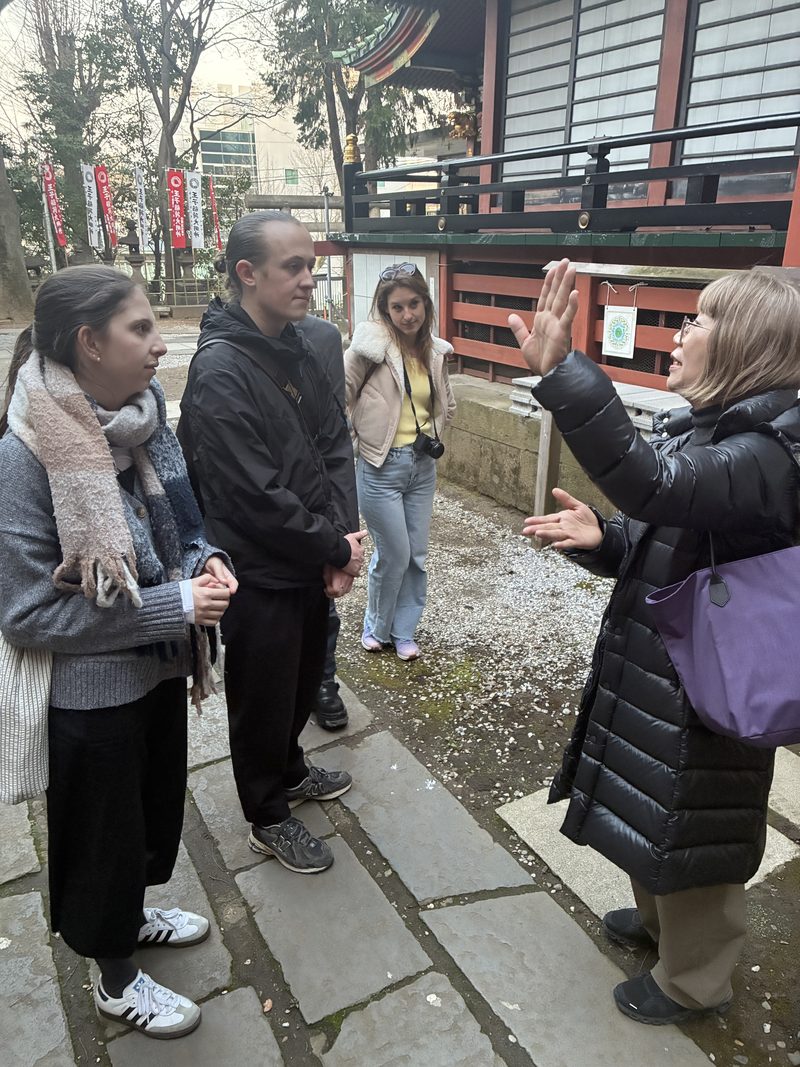 A guide explaining a small neighbourhood shrine