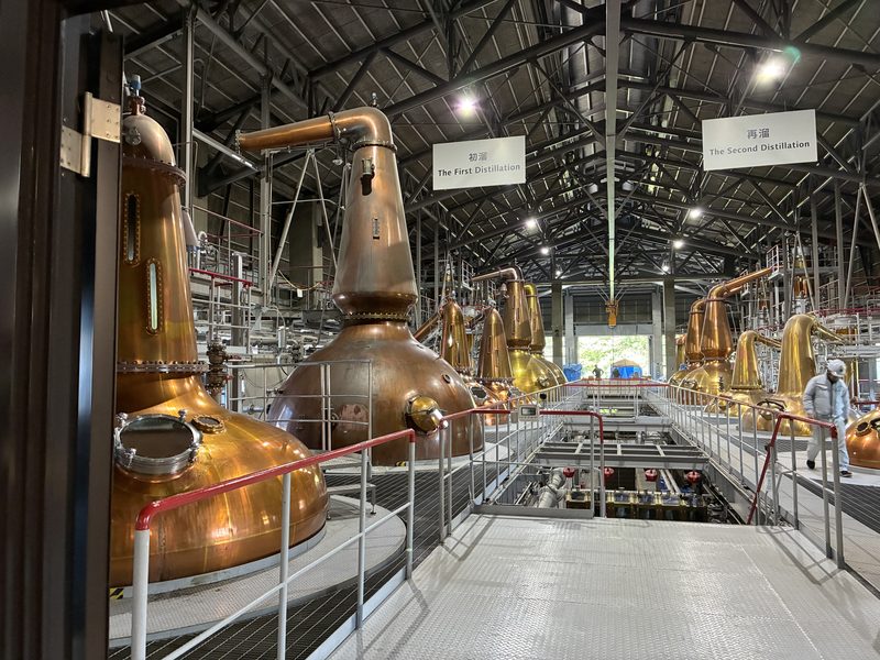 Copper pot stills in the still house of a Japanese whisky distillery