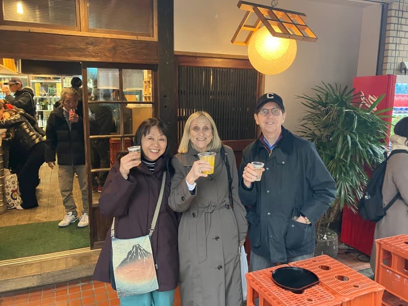 A toast outside a sake shop in Yanaka